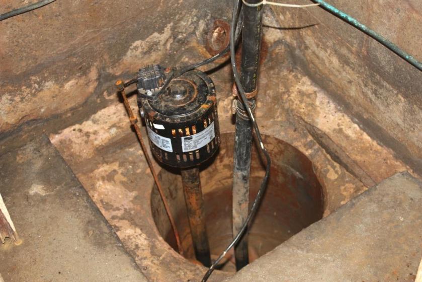 Sump pump in corner of basement keeps it dry. I don't have a photo of the new pump which replaced this relic last year.